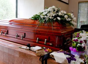 closeup shot of a colorful casket in a hearse or chapel before f